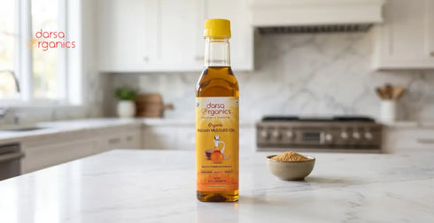 mustard oil bottle on marble counter in modern kitchen with seeds and natural light